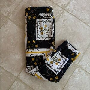 NY & Co Audrey crop pant. Black, White & Yellow Floral print size 10